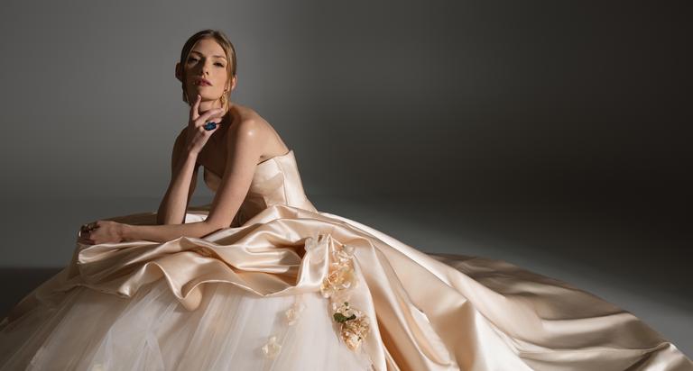 Bride in elegant white wedding gown showcasing luxury bridal fashion by Lazaro Perez