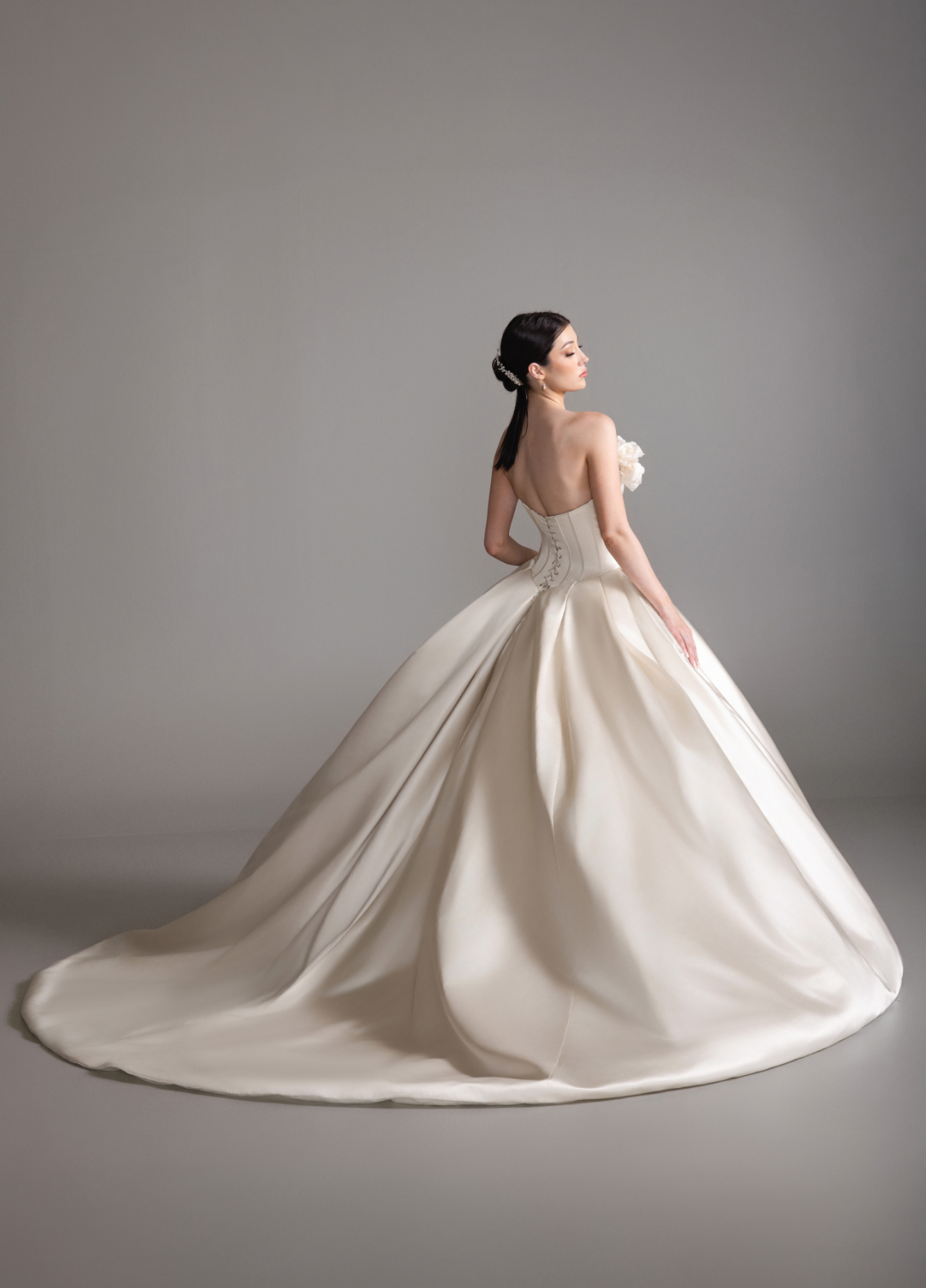 BEHATI bridal dress back view showcasing circular skirt and chapel train