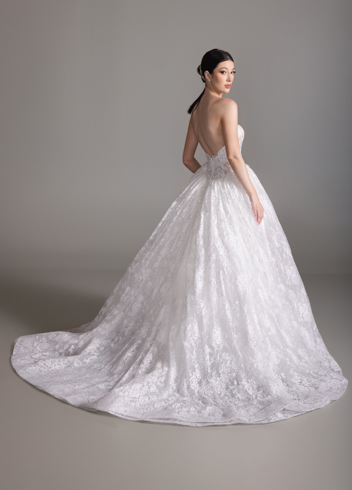 BENITA bridal dress back view showcasing softly draped skirt and chapel train