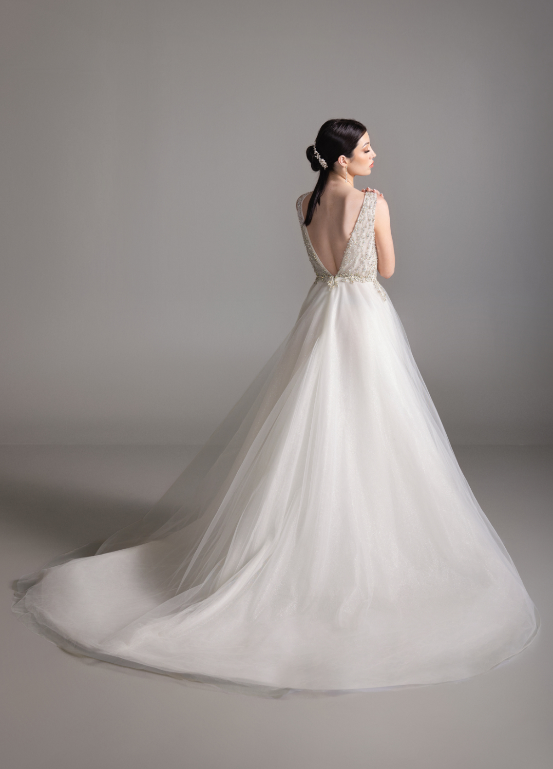 BRIAR bridal dress back view showcasing circular skirt and chapel train