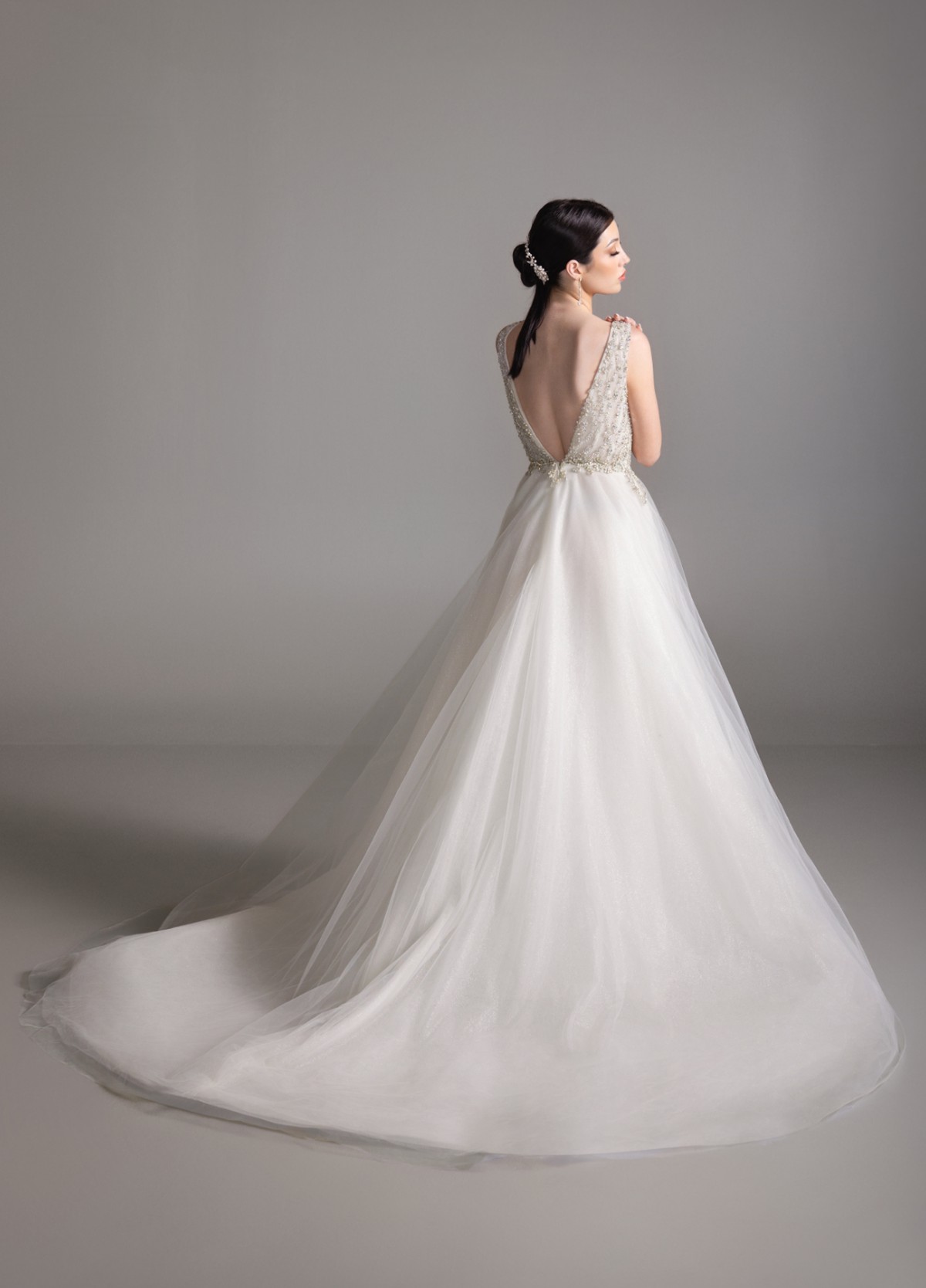 BRIAR bridal dress back view showcasing circular skirt and chapel train