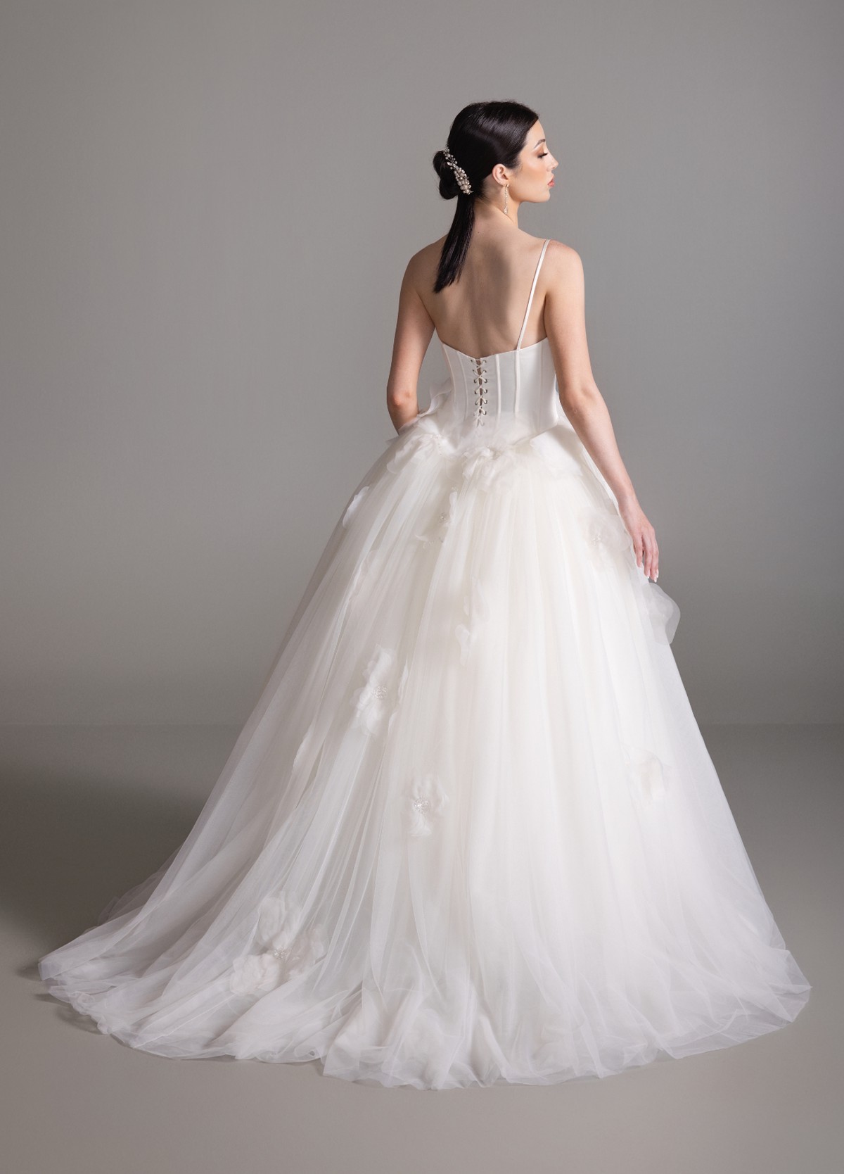 BRITTANY bridal dress back view showcasing voluminous skirt and chapel train