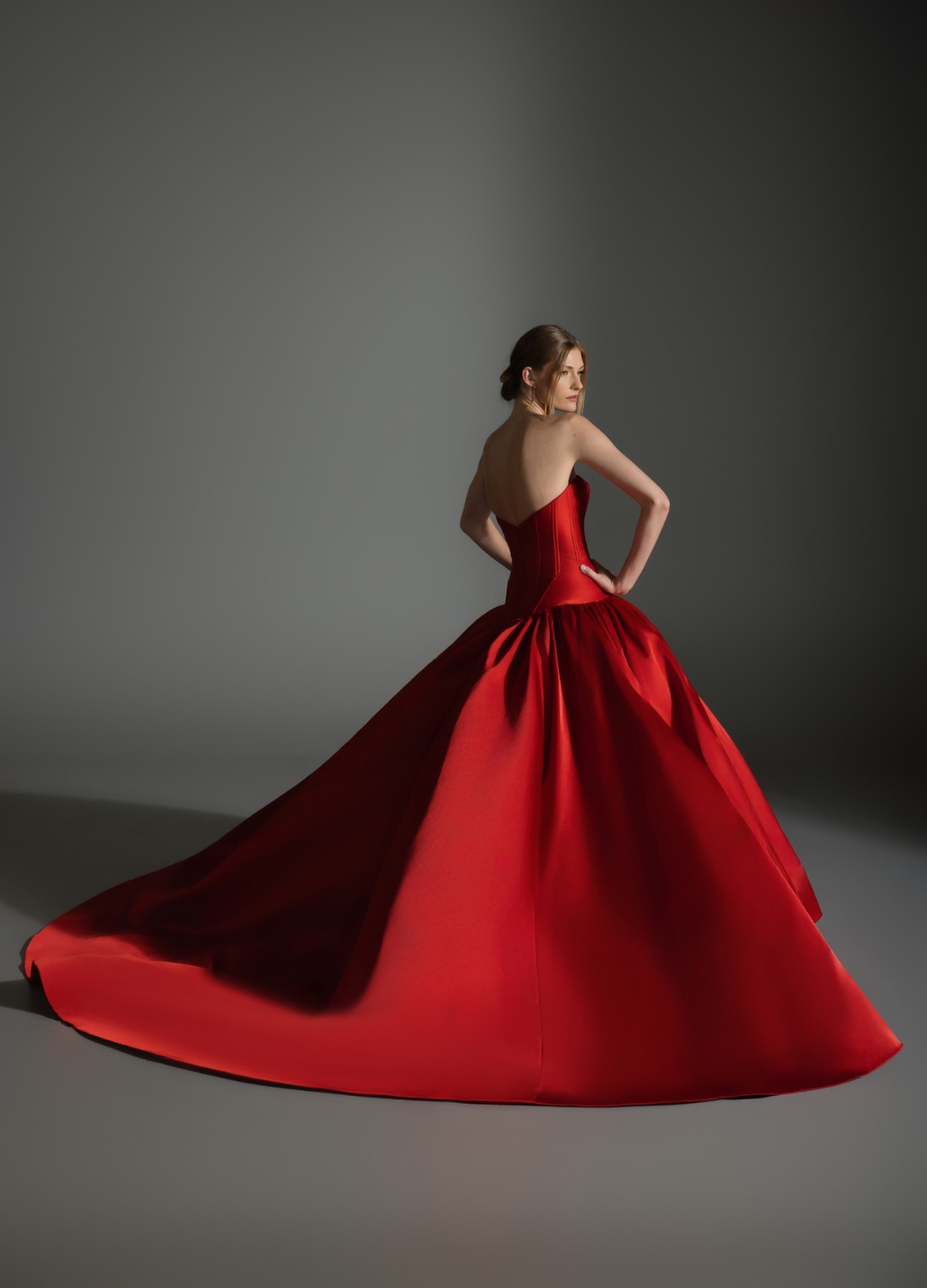 AKARI bridal gown back view showcasing sculptural volume and chapel train drama