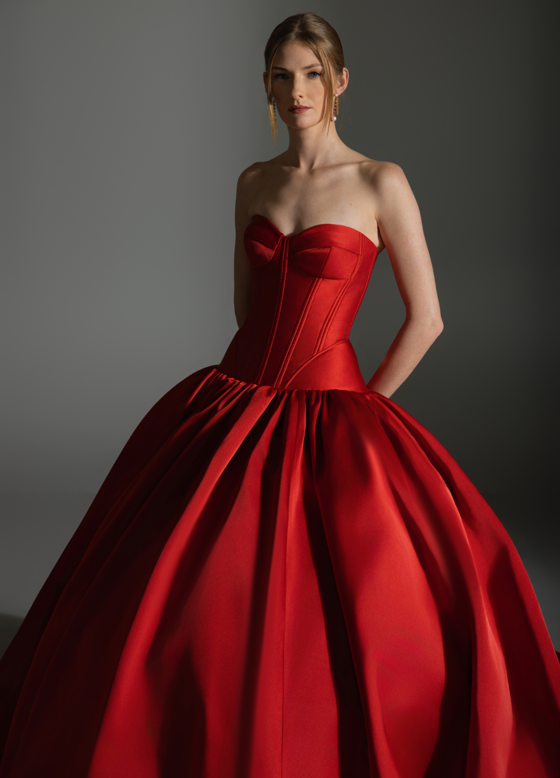AKARI gown in rich garnet color highlighting bold dramatic couture focal point