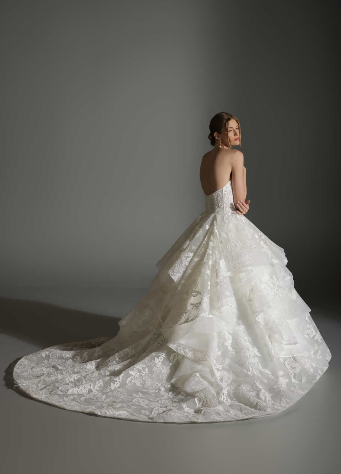 ANABEL bridal gown back view showcasing dramatic skirt flowing into chapel train