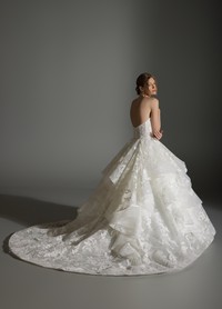 ANABEL bridal gown back view showcasing dramatic skirt flowing into chapel train