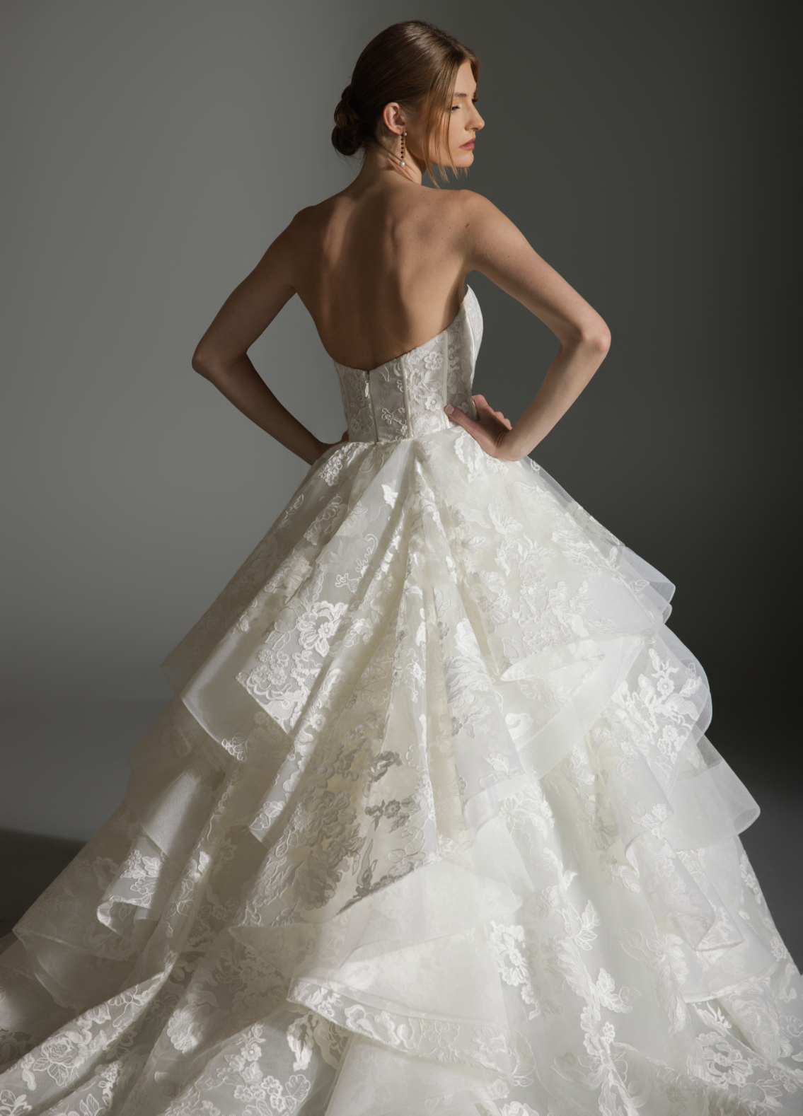 ANABEL wedding dress featuring curved neckline highlighting intricate lace detail
