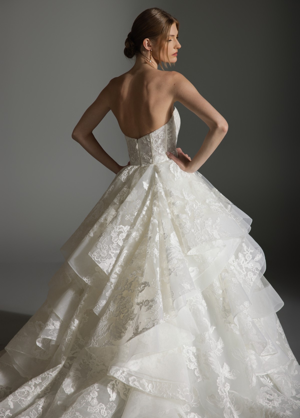 ANABEL wedding dress featuring curved neckline highlighting intricate lace detail