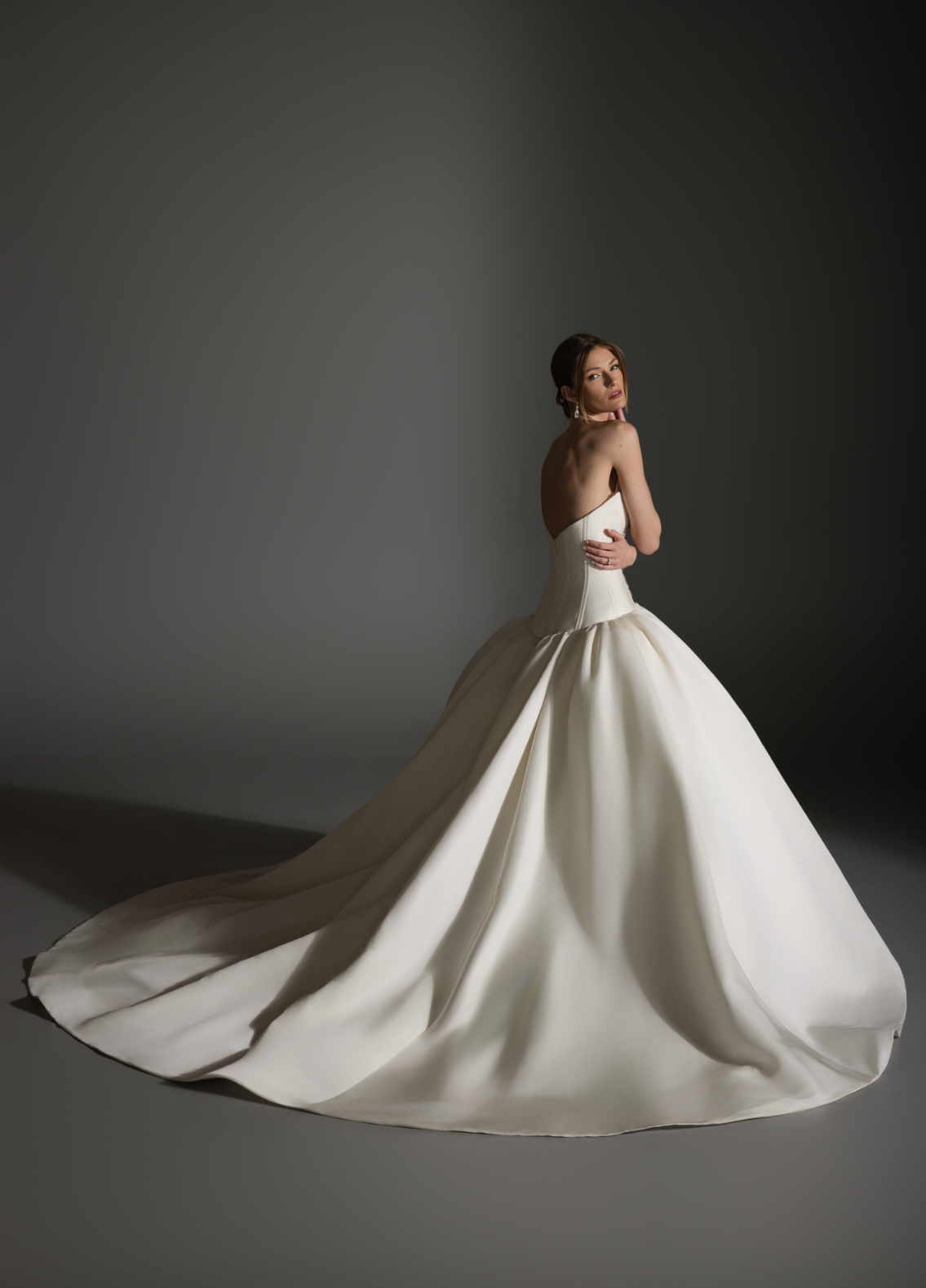 ANTONETTE bridal gown back view with dramatic panniers and sculptural volume
