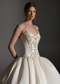 ANTONETTE wedding dress showcasing refined structure and luminous embellishment