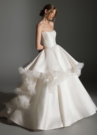 APRIL gown detail of curved neckline with organza petal floral accents and texture