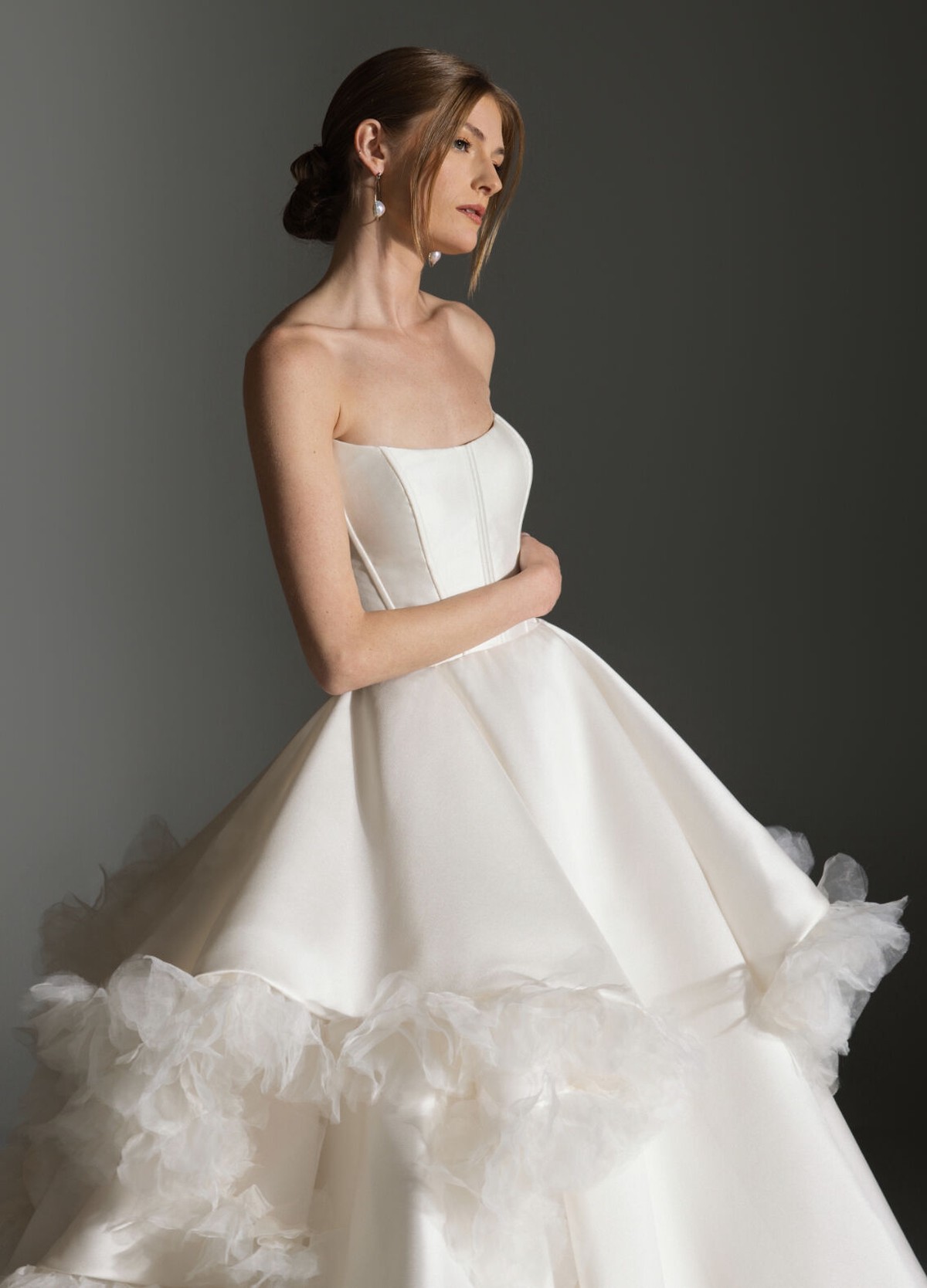 APRIL wedding gown showcasing dramatic waterfall skirt flowing into chapel train