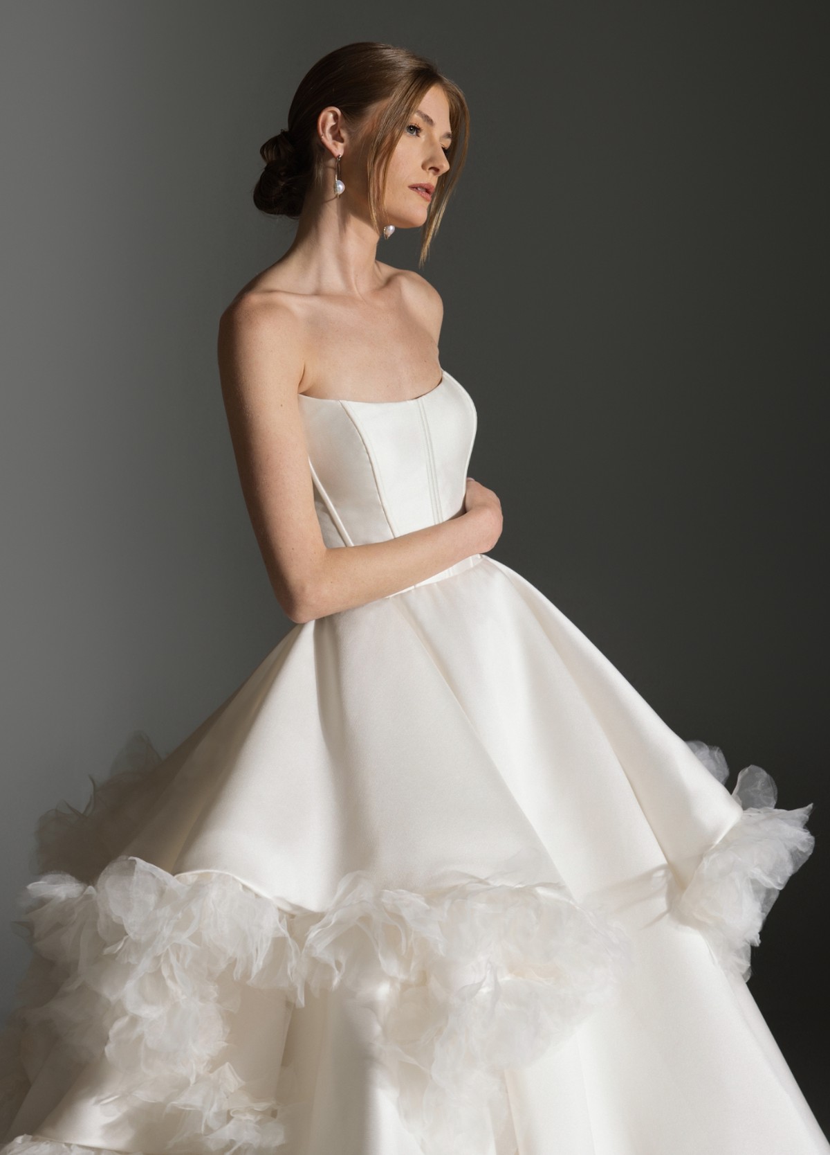 APRIL wedding gown showcasing dramatic waterfall skirt flowing into chapel train