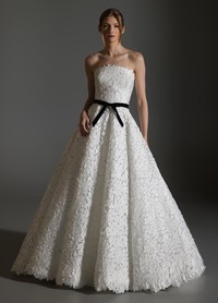AVERY ivory ball gown with laser-cut petal embroidery and black velvet bow belt