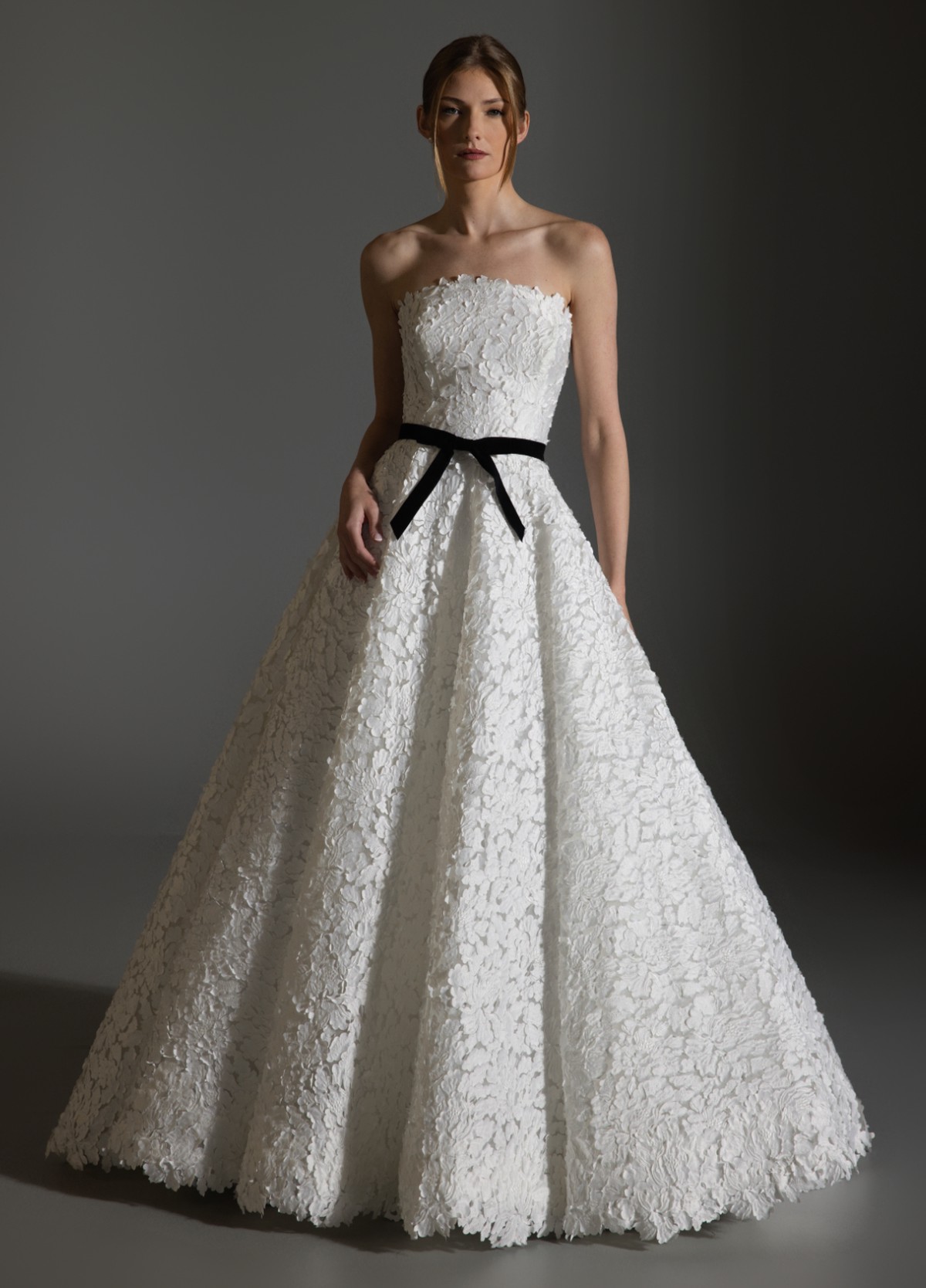 AVERY ivory ball gown with laser-cut petal embroidery and black velvet bow belt