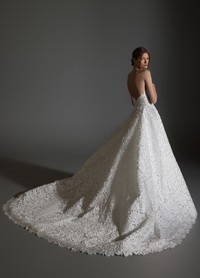 AVERY bridal gown back view showcasing full circular skirt and chapel train flow