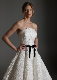 AVERY wedding dress featuring clean horizontal neckline and statement bow detail
