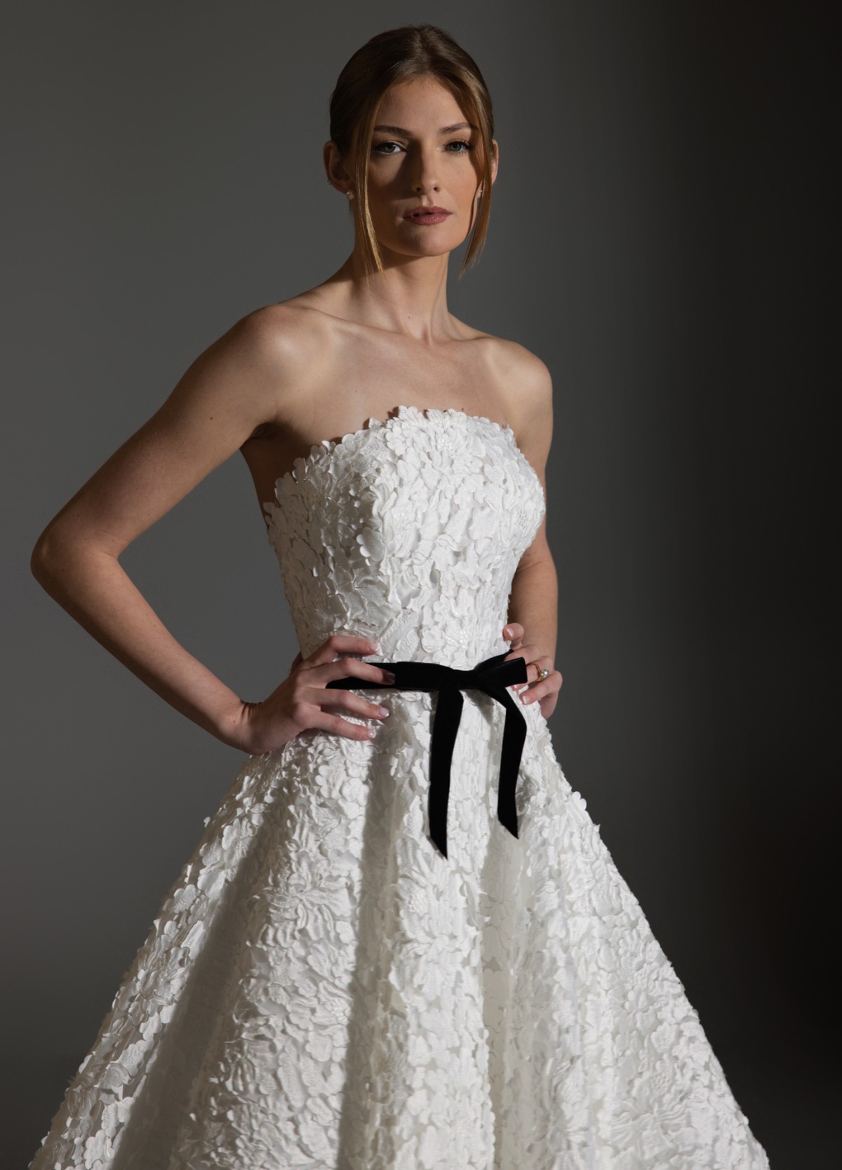 AVERY wedding dress featuring clean horizontal neckline and statement bow detail