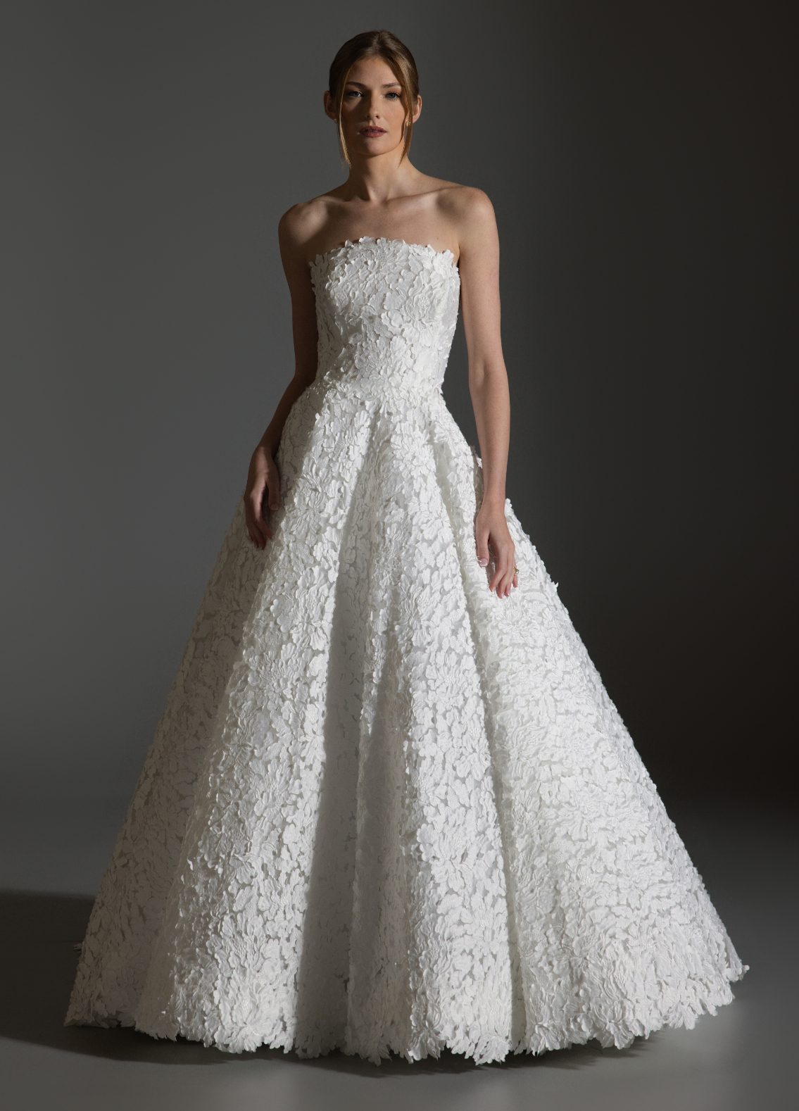 AVERY gown highlighting laser-cut petal embroidery and refined signature accent