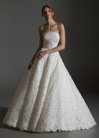 AVERY dress detail of black velvet bow belt creating striking couture contrast