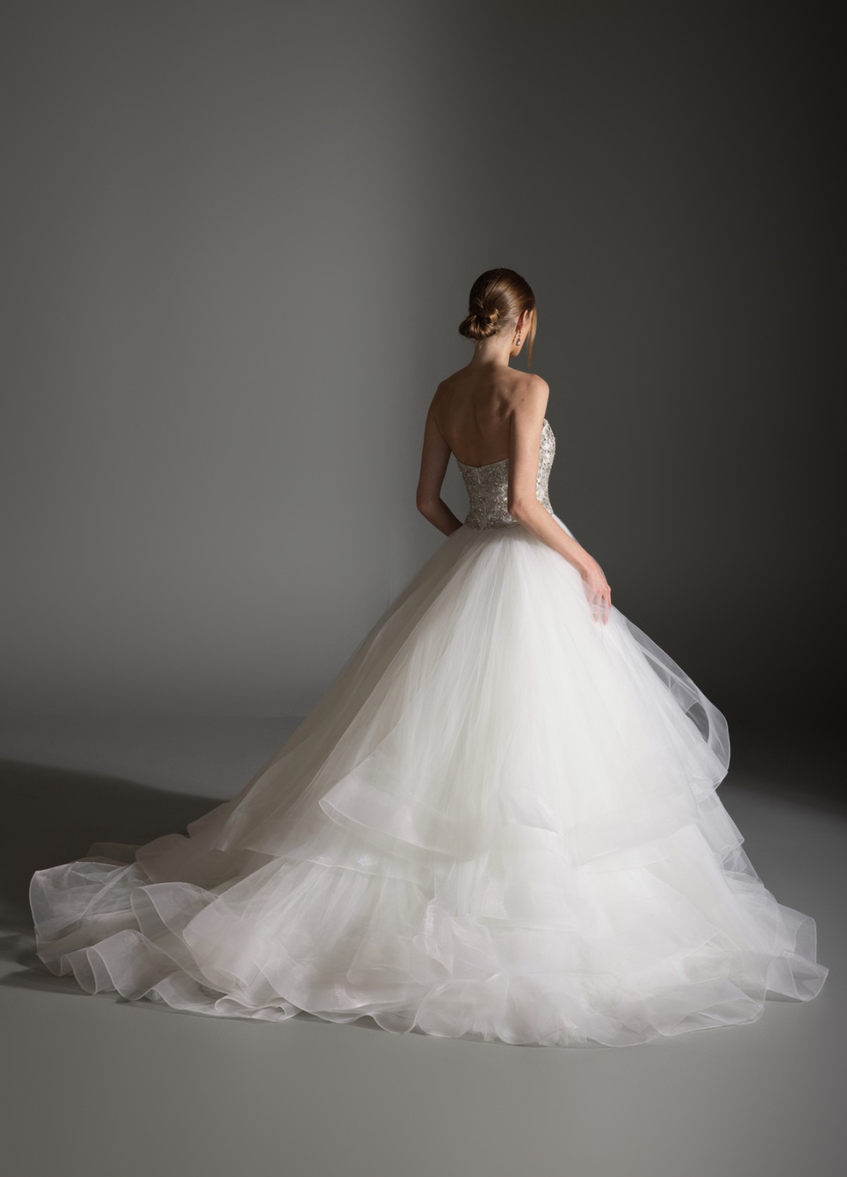 AVRIL bridal dress back view showcasing dramatic volume and chapel train flow