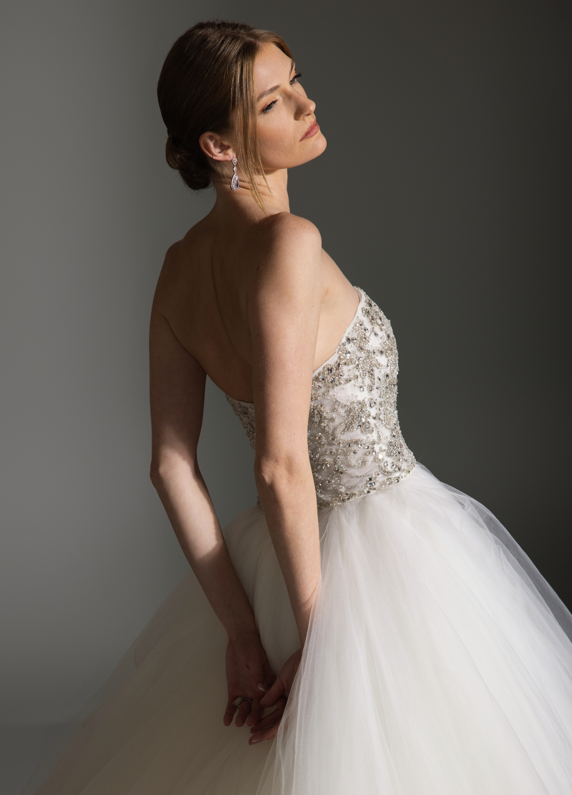 AVRIL wedding gown featuring classic sweetheart neckline with luminous sparkle