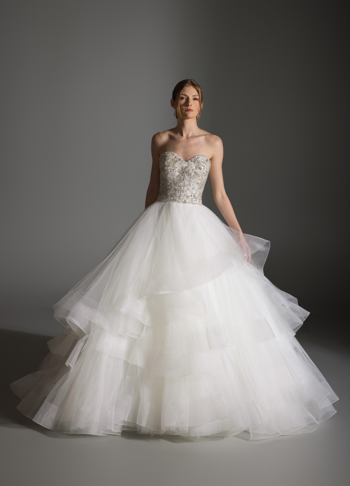 AVRIL gown highlighting tiered skirt creating soft yet dramatic romantic volume