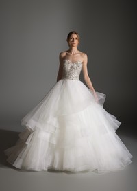 AVRIL gown highlighting tiered skirt creating soft yet dramatic romantic volume